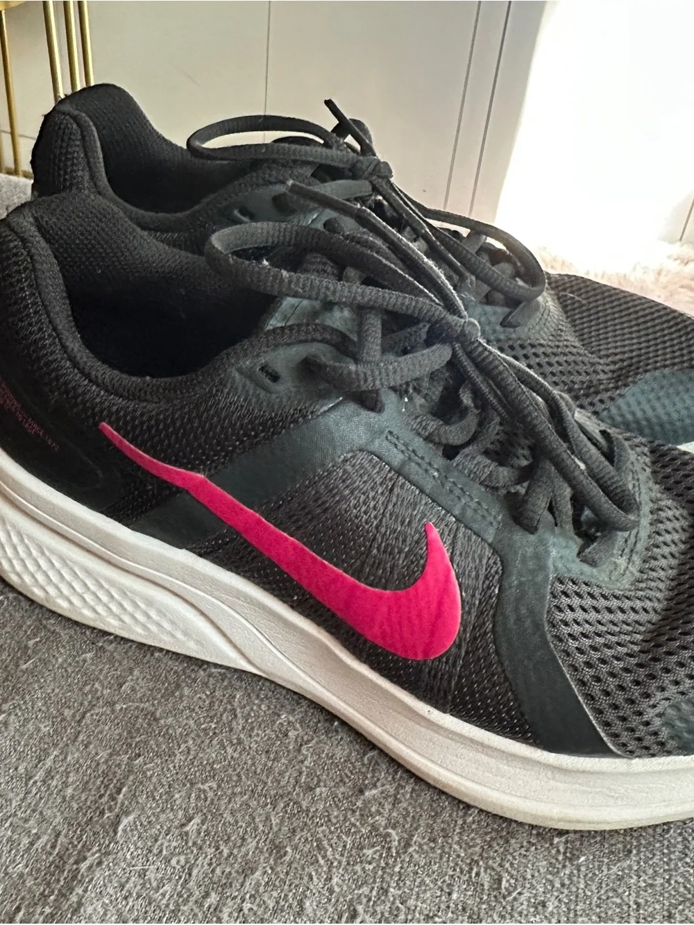 Nike Women's Black Athletic Shoes with Pink Swoosh